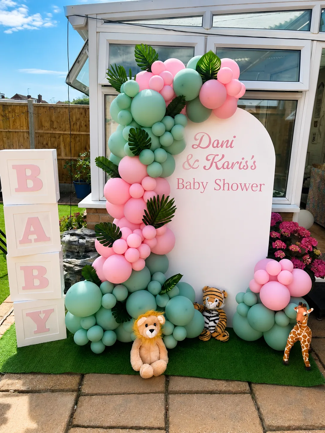 Safari jungle baby shower balloon backdrop with lion, tiger and giraffe props by Little Moment Studio Kent