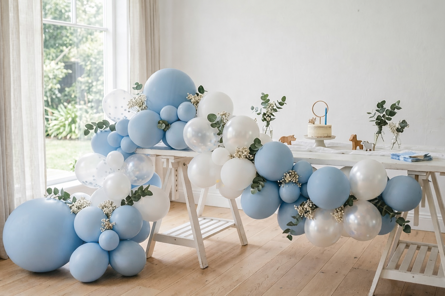 First birthday balloon garland in powder blue and white styled by Little Moment Studio Kent